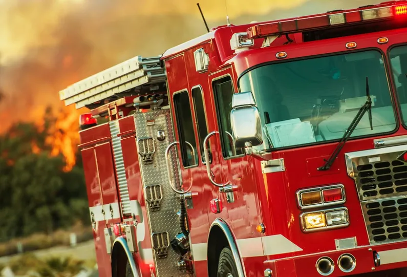Appraiser evaluating a fire truck in a station